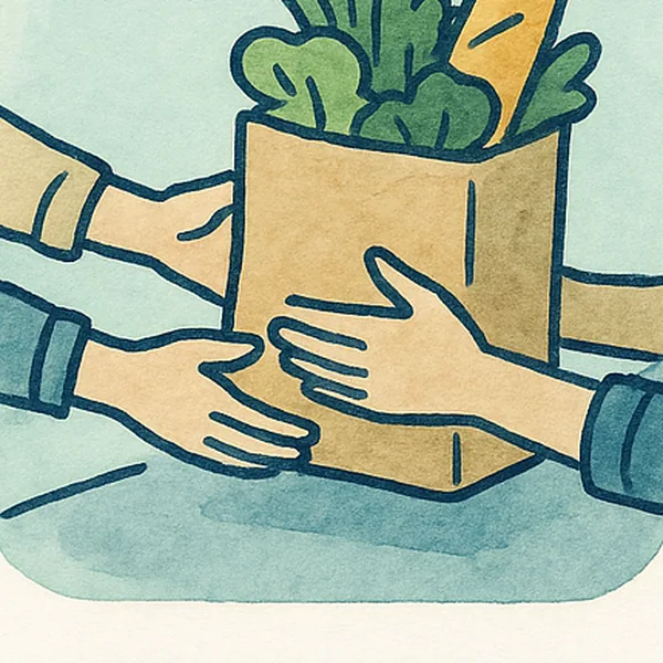 Hands passing a bag of fresh food across a counter