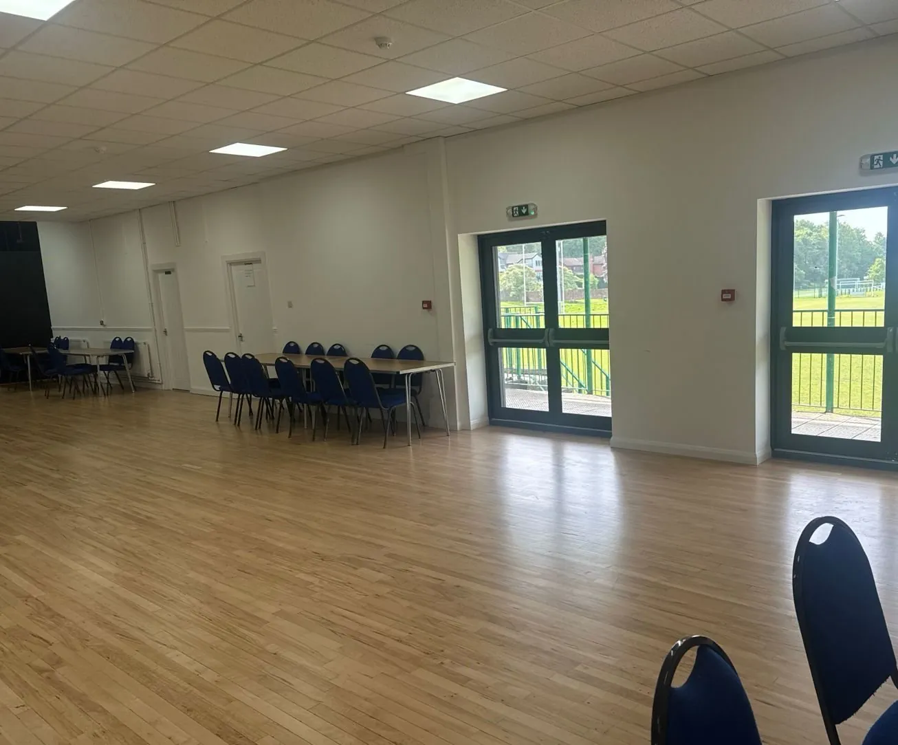 Hall doors opening onto the balcony overlooking the playing fields